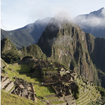 Classic Inca Trail archaeological stone ruins and mountain view